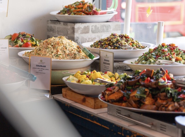 Fresh buffet display with colorful salads and healthy options at Octagreen