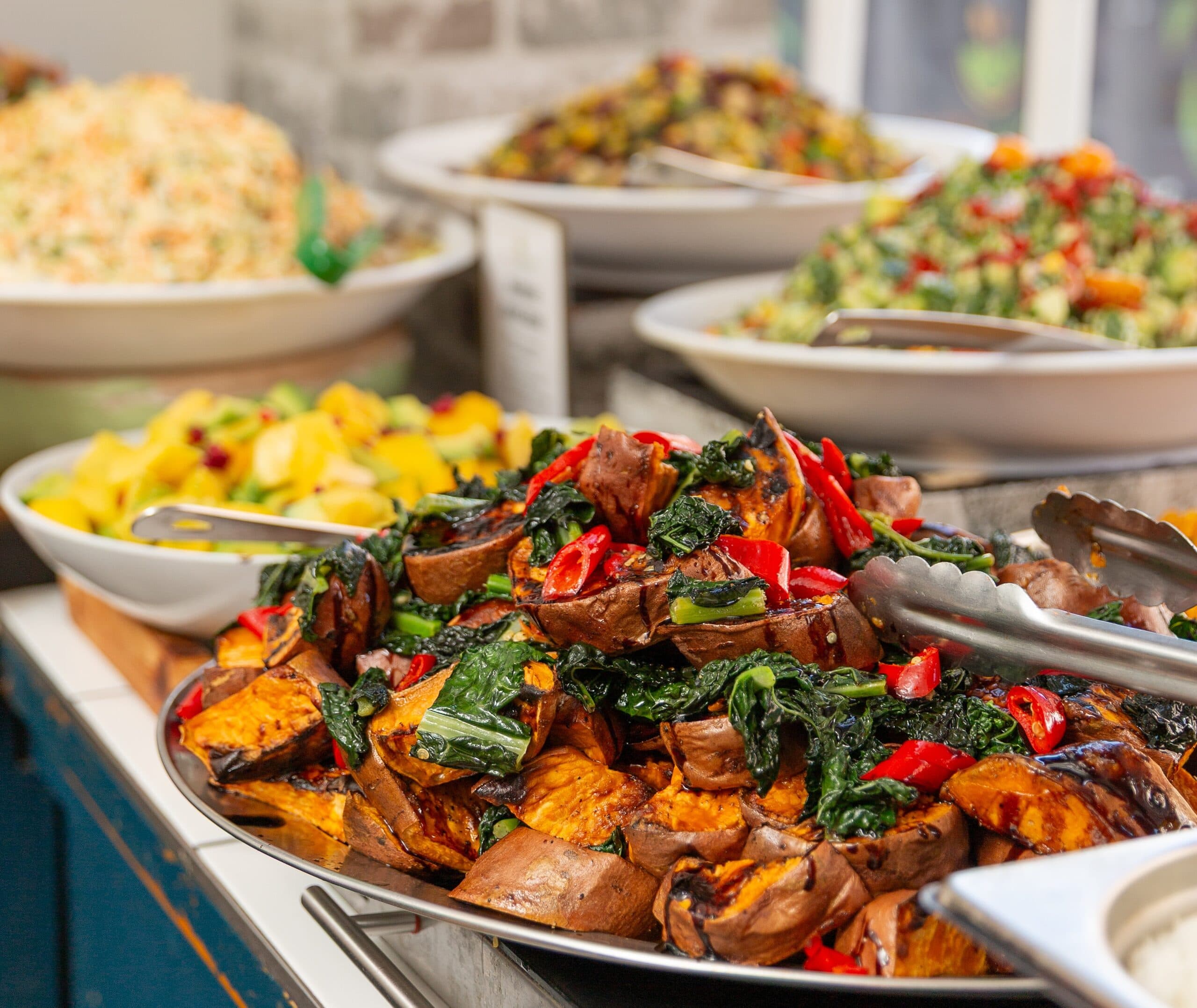 Diverse healthy buffet spread with fresh salads and hot dishes at Octagreen