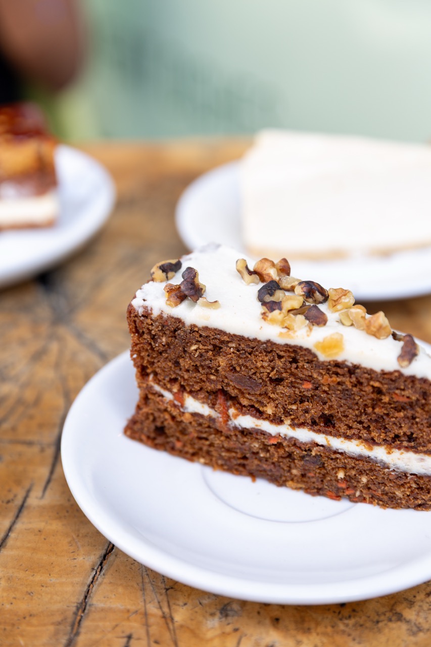 Homemade carrot cake with cream cheese frosting and walnuts