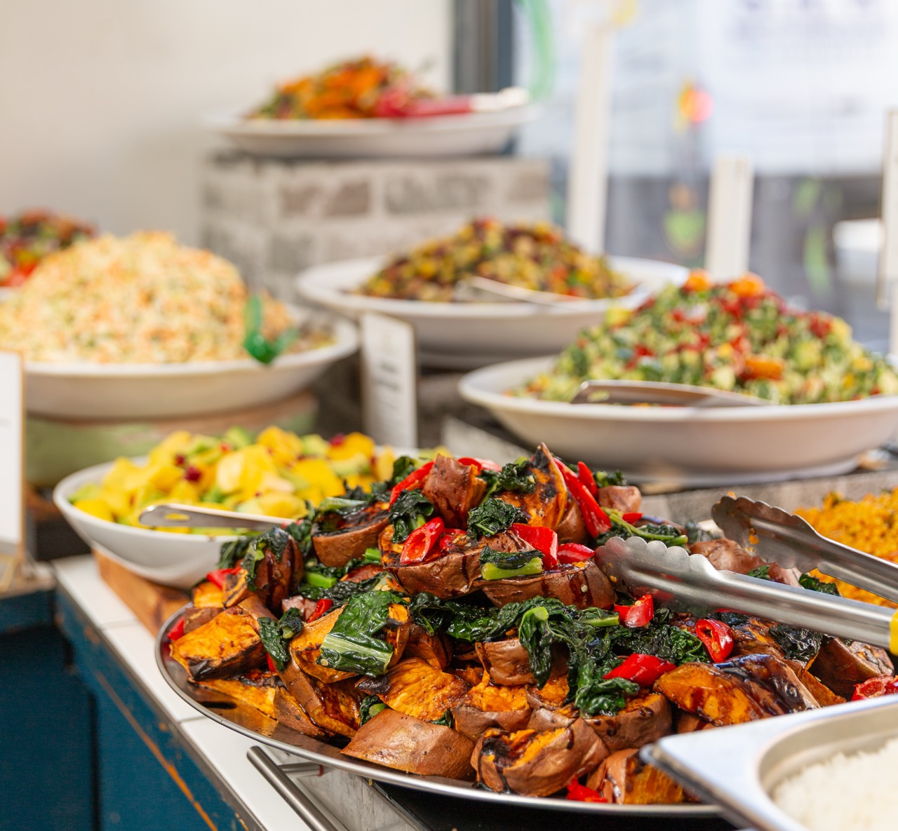 Colorful array of buffet dishes and salads