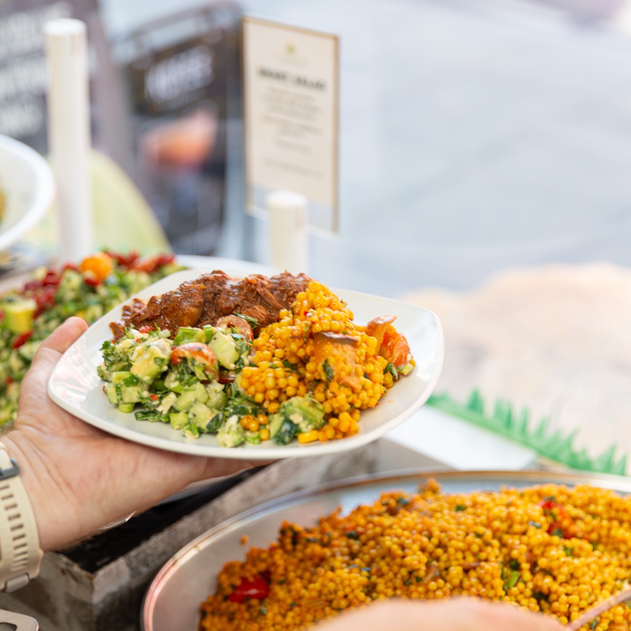Healthy buffet plate with couscous and fresh salads
