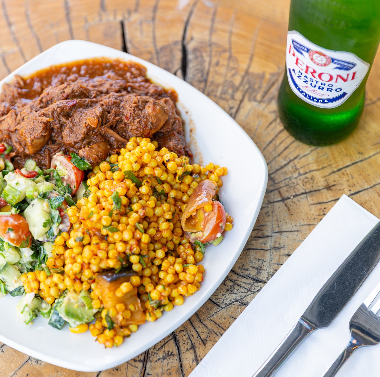 Hearty stew served with golden couscous