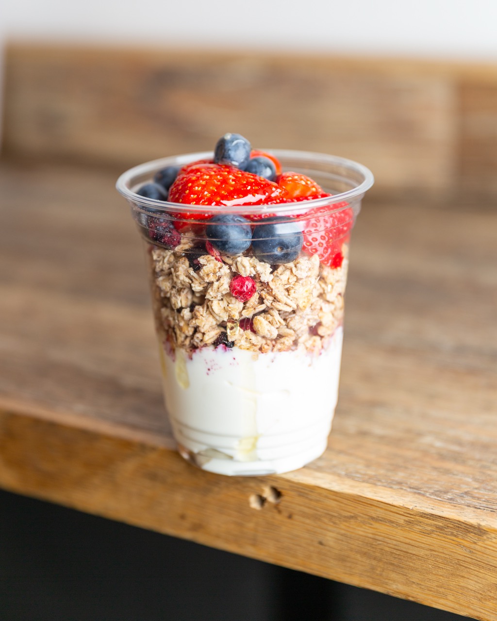 Layered yogurt parfait with fresh berries and granola